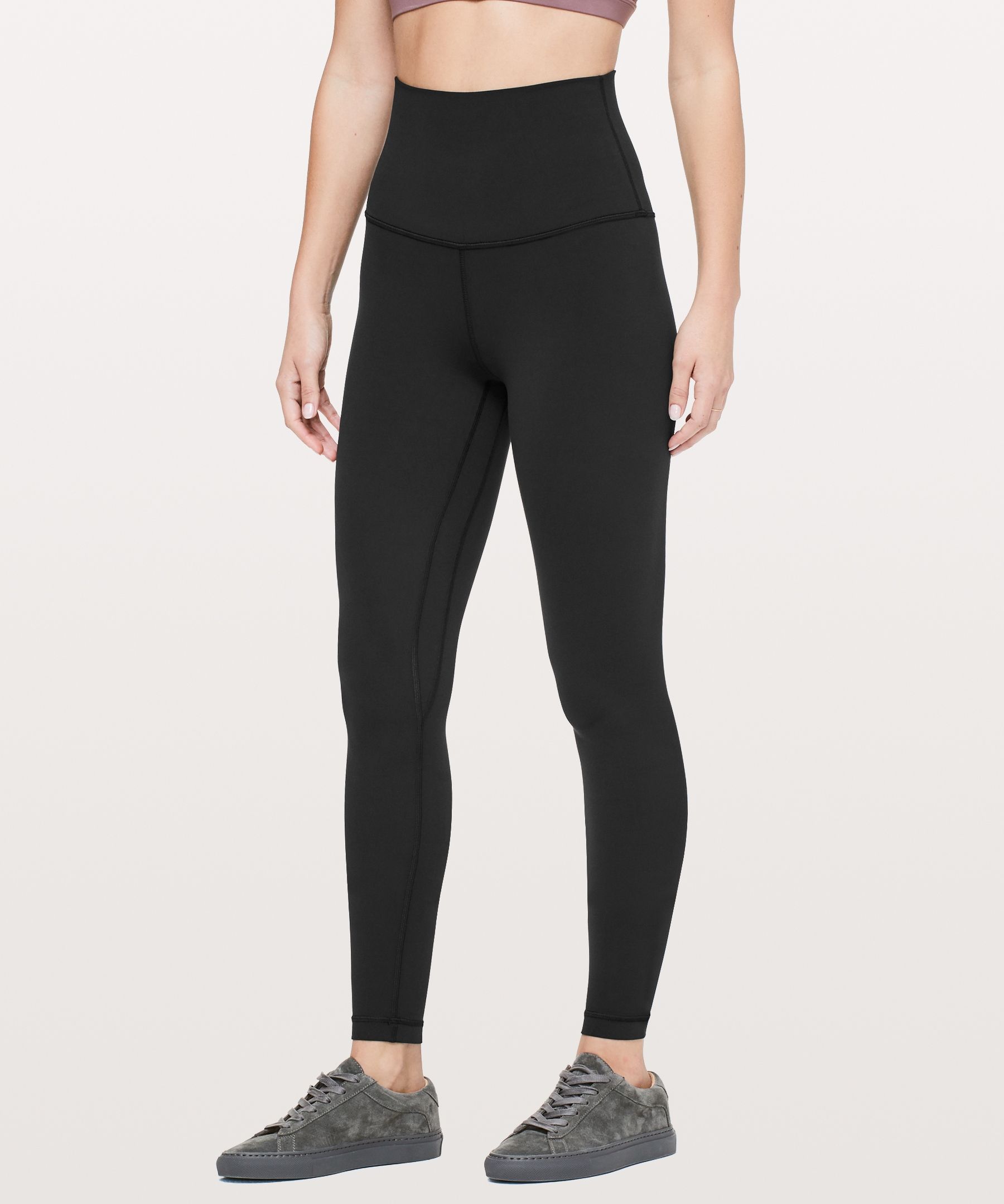 A folded pair of black Lululemon leggings