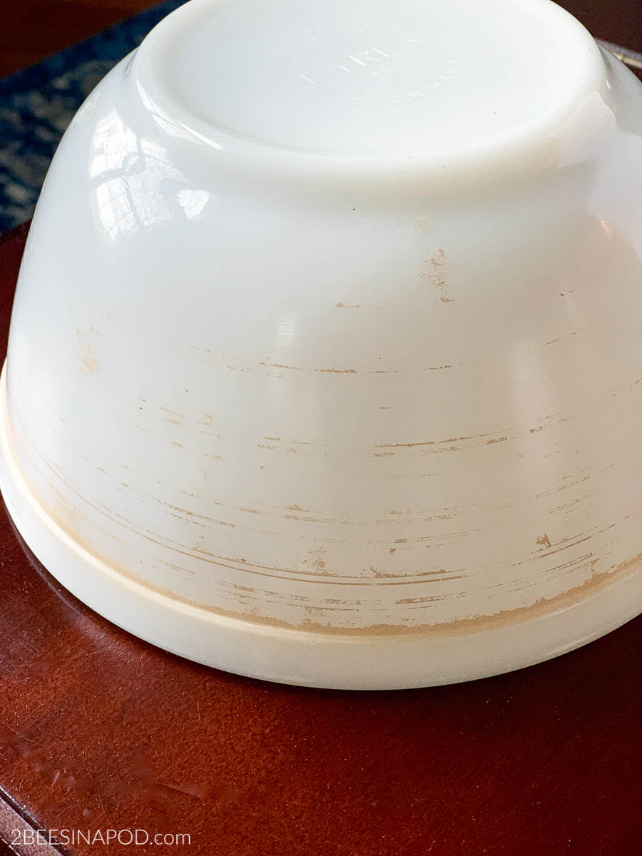 A vintage Pyrex bowl with dishwasher-faded color