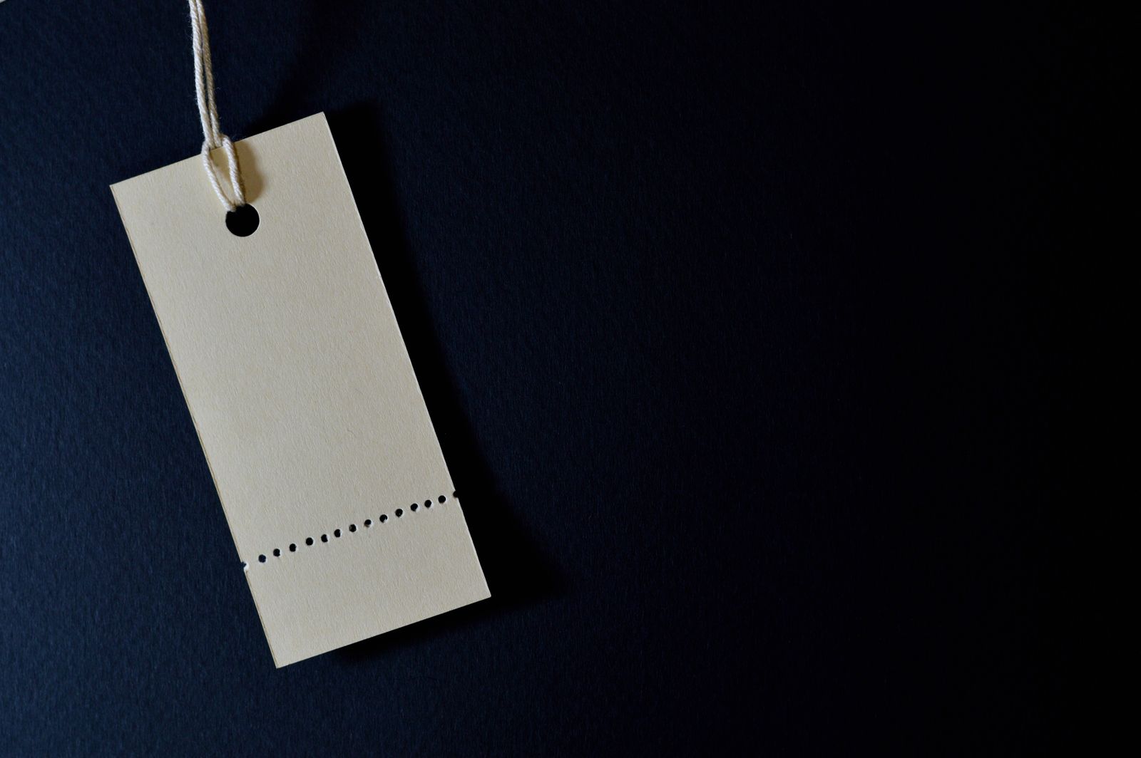 Cardboard price tags attached to garments